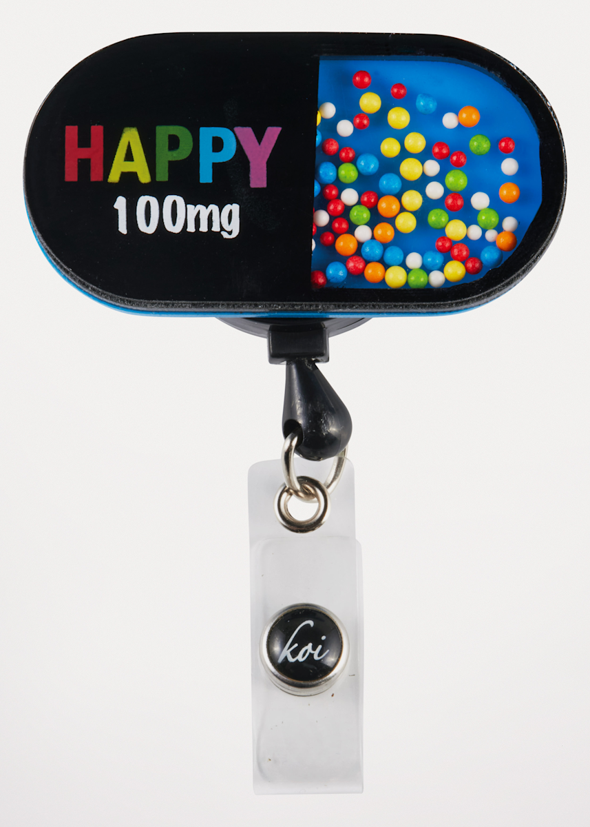 Koi Basics Koi Happy Pill Badge Reel